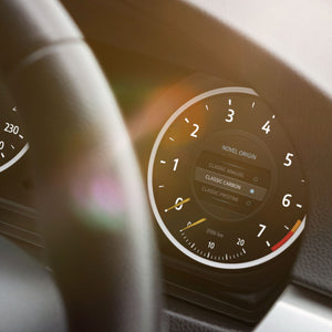 Digital Cluster featuring the Novel Origin theme from ID4Motion, in color variation Classic Carbon.